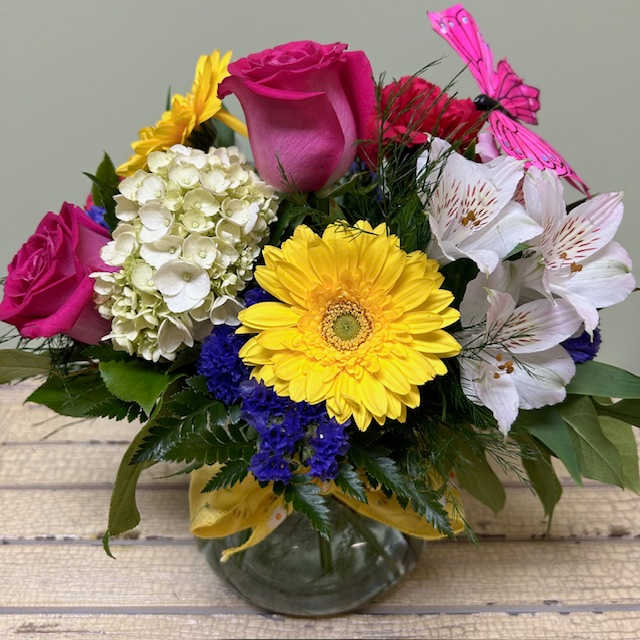 Perfect Posie MD41 - Sweet as can be, this precious posie vase of daisies, hydrangea, and roses is a perfect gift any day of the week.  Upgrading to a Deluxe or Premium bouquet will add more flowers to the arrangement.