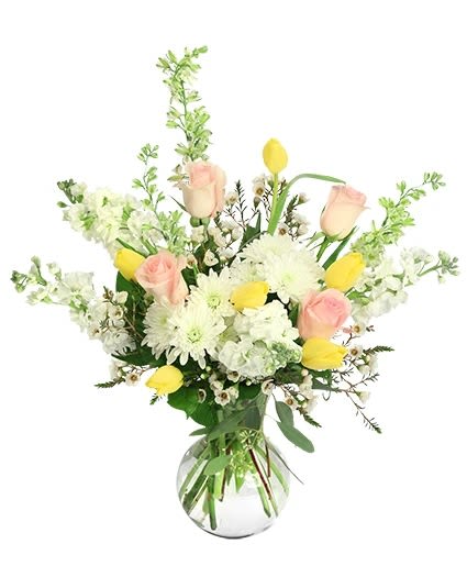 Bouquet of pink roses, white daisies, and yellow tulips in a glass vase
