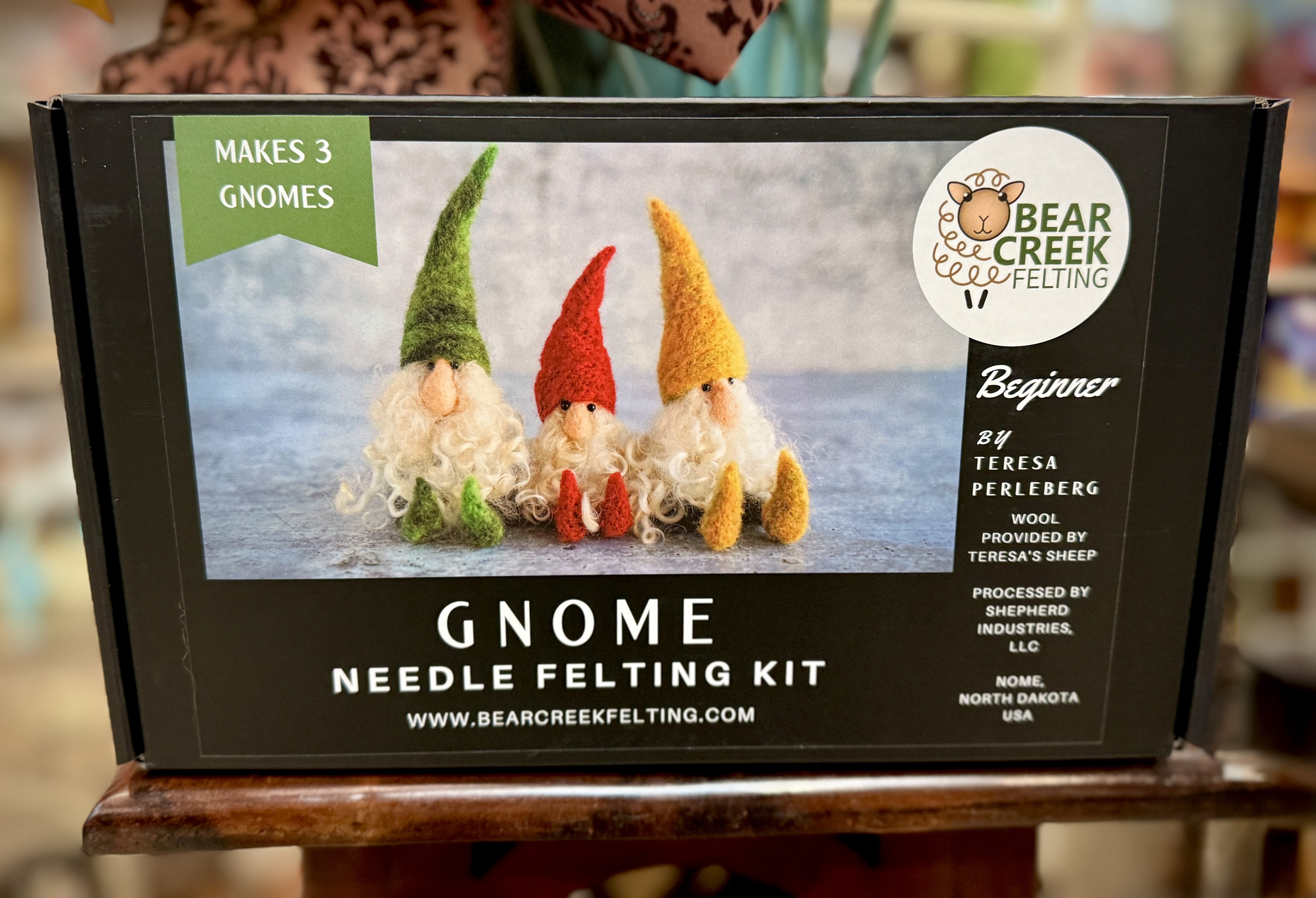 Boxed gnome needle felting kit with three felt gnomes pictured