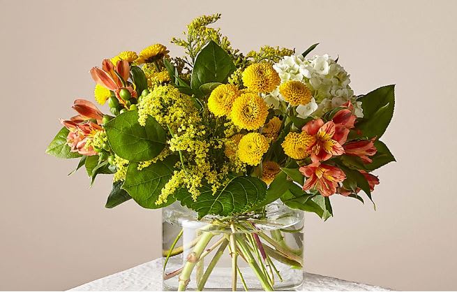 Life's a Peach Bouquet - This radiant bouquet is designed with a dreamy mix of peach, yellow, and light green blooms to create the perfect impression. Whether it's sent as a pick–me–up, a celebration, or just to make someone smile, everything is just peachy once this arrangement arrives.