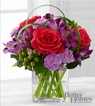 The FTD® Be Bold™ Bouquet by Better Homes and Gardens®  - FTD® proudly presents the Better Homes and Gardens™ Be Bold™ Bouquet. Blooming with bright colors to boldly express your every emotion, this exquisite flower bouquet is set to celebrate. Hot pink roses, purple Peruvian Lilies, lavender mini carnations, green hypericum berries, lily grass blades, and lush greens are brought together to create an incredible flower arrangement. Presented in a clear glass cube vase, this mixed flower bouquet will make that perfect impression on a birthday, anniversary, or as a way to extend your congratulations or thank you wishes. Is approximately 9"H x 10"W.