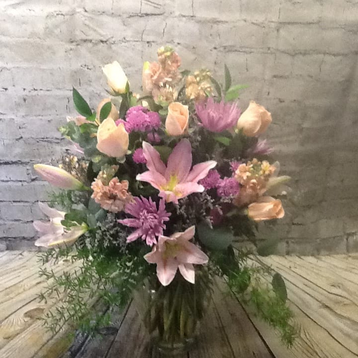 Pink and peach mixed bouquet with lilies and chrysanthemums in a vase