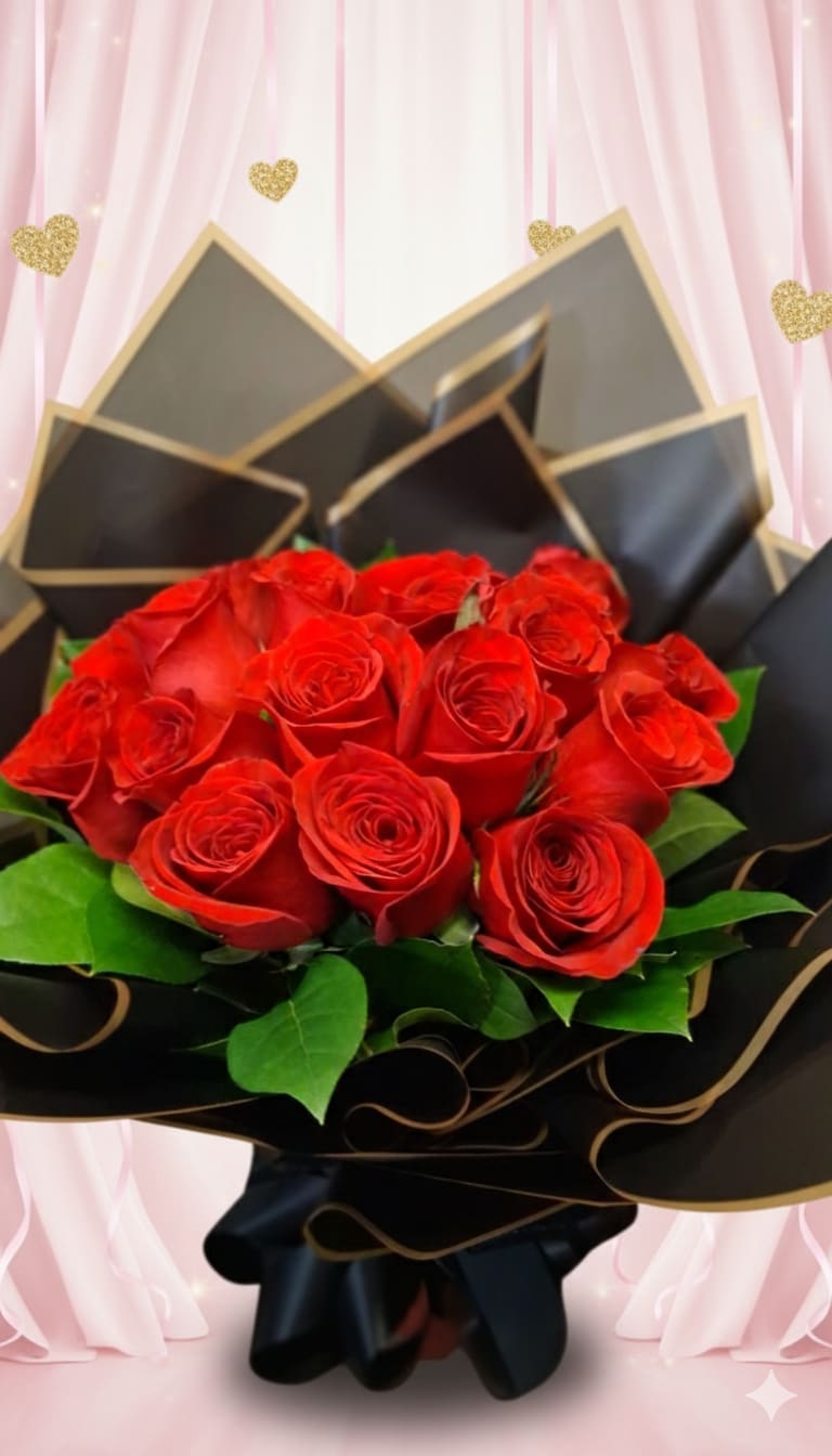 Bouquet of red roses wrapped in black paper with gold trim