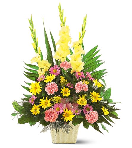 Tall mixed flower arrangement in a gold vase with yellow and pink blooms