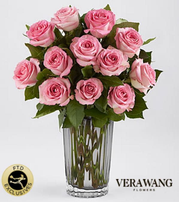 The FTD® Blush Rose Bouquet by Vera Wang - World-acclaimed designer Vera Wang brings her signature style to an extraordinary bouquet, perfect for making any occasion "grand." Each flower in this extravagance of blushing pink roses, is individually hand-selected for the richness of its color, exquisite fullness and its long stem. The bouquet is hand-arranged in an oval vase of heavy, ribbed glass tinted with a "veil" of understated neutral gray that expresses the designer's elegant, romantic point of view. Your purchase includes a complimentary personalized gift message.