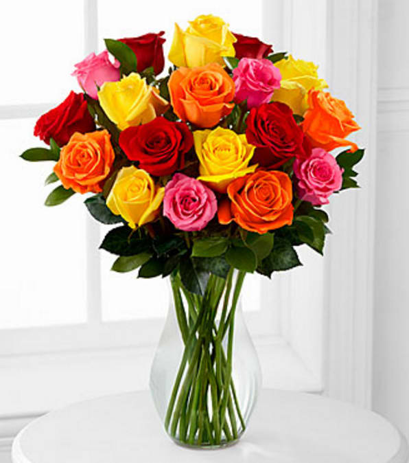 Mixed 18 Long Stem Roses - VASE INCLUDED - Picked fresh from the farm to offer your special recipient a bouquet that brings brilliant color to any of life's special occasions, our Long Stemmed Mixed Rose Bouquet will delight your special recipient with each fragrant bloom. Hand gathered in select floral farms and boasting an array of bright hues, this flower arrangement has been picked fresh for you to help you celebrate a birthday, anniversary, or express your thank you wishes. This bouquet includes the following: mixed roses and an assortment of lush greens. Available with a selection of vases to fit your gifting needs. BETTER bouquet is approximately 19"H x 16"W.  50cm Roses are reduced to be proportionate to the vase, providing a good customer experience. Your purchase includes a complimentary personalized gift message.