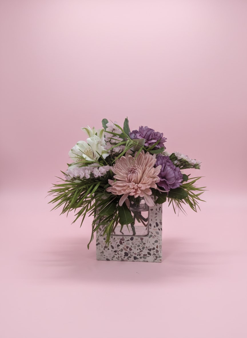 Stone &amp; Stem  - Modern, timeless, and naturally elegant, Stone &amp; Stem is a thoughtfully designed floral arrangement that pairs soft seasonal blooms with lush greenery in a contemporary stone vase. Featuring a harmonious blend of premium flowers in a refined color palette, this design is full of texture, movement, and effortless beauty.  Whether you’re celebrating a birthday, expressing sympathy, welcoming a new baby, saying thank you, or simply brightening someone’s day, Stone &amp; Stem is a versatile arrangement that complements any home or office décor.   Each arrangement is handcrafted by the designers at Moose Lake Florists, making every piece one of a kind. While flower varieties may change with the seasons, you can always expect the same modern garden-inspired style, exceptional quality, and beautiful presentation.  *Flowers and containers may vary slightly based on seasonal availability while maintaining the overall design, color palette, style, and value.*