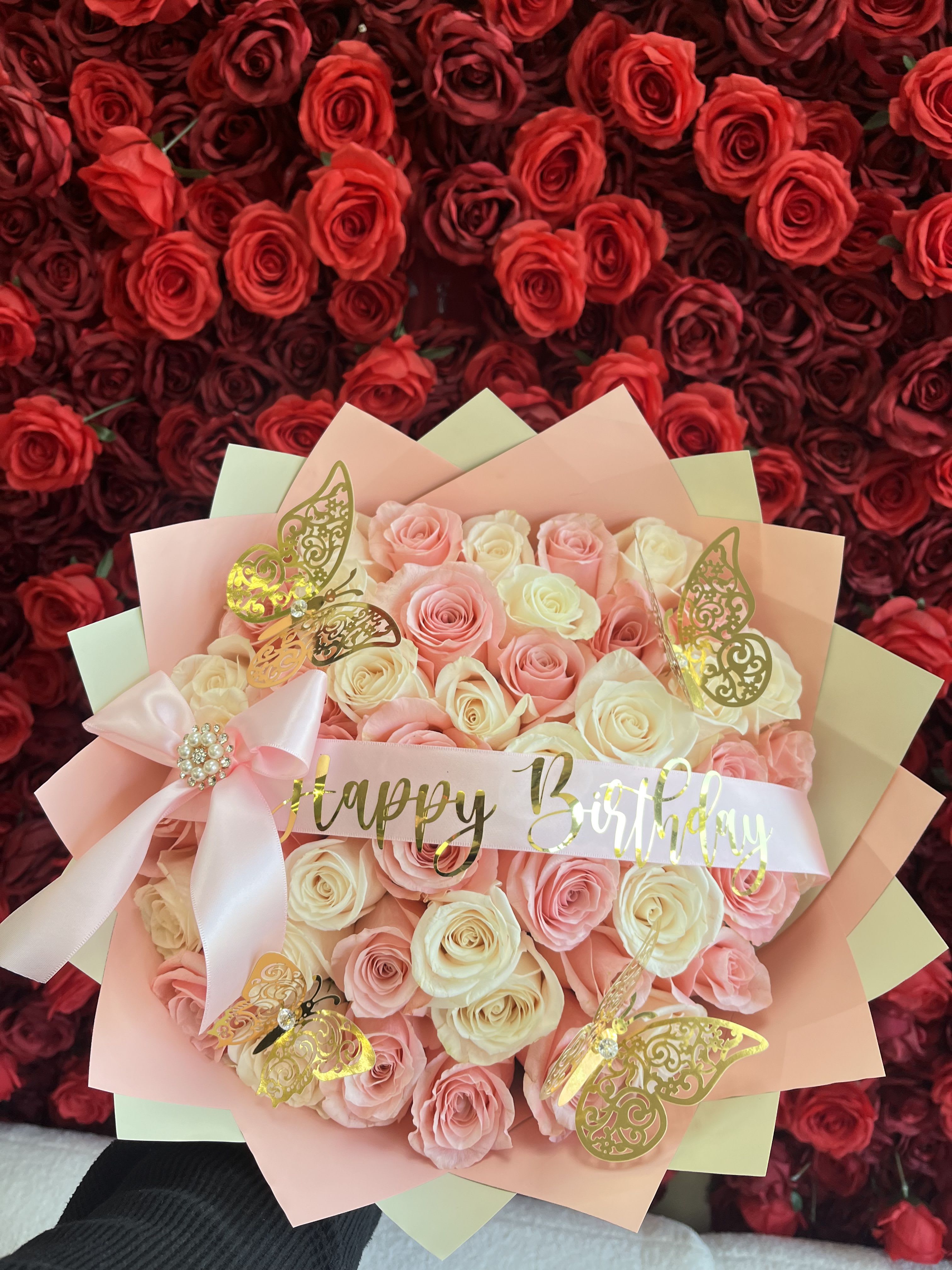 Pink and cream rose bouquet with a Happy Birthday ribbon