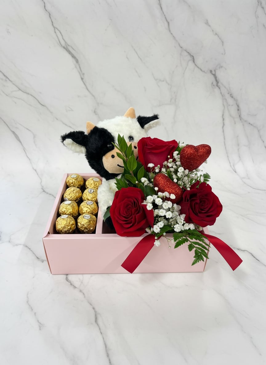 Red roses with chocolates and a plush cow in a pink gift box