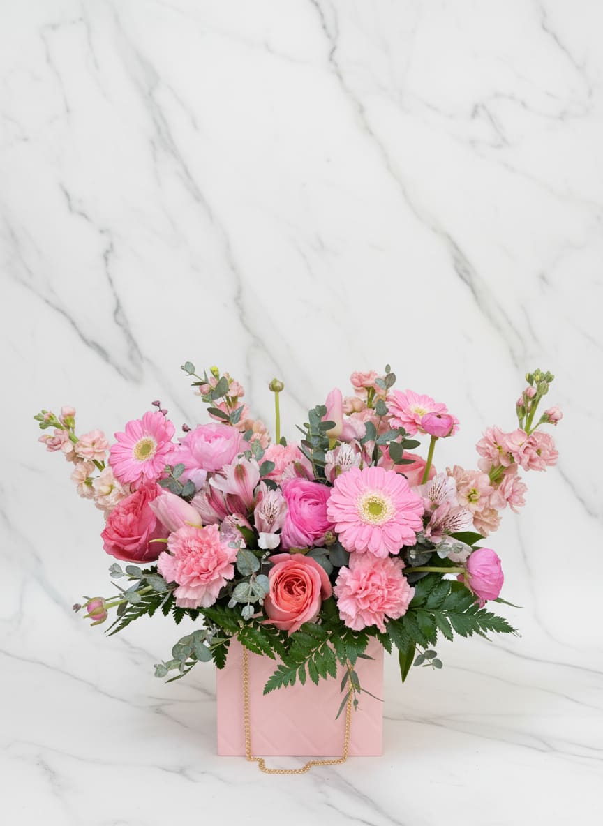 Wild Blooming Purse - Pink, white &amp; green blooms-gerberas, roses, carnations, tulips &amp; alstroemeria-arranged in a blush gift bag with gold rope handle. Cheerful, romantic gift for Mother's Day, birthdays, or just because.