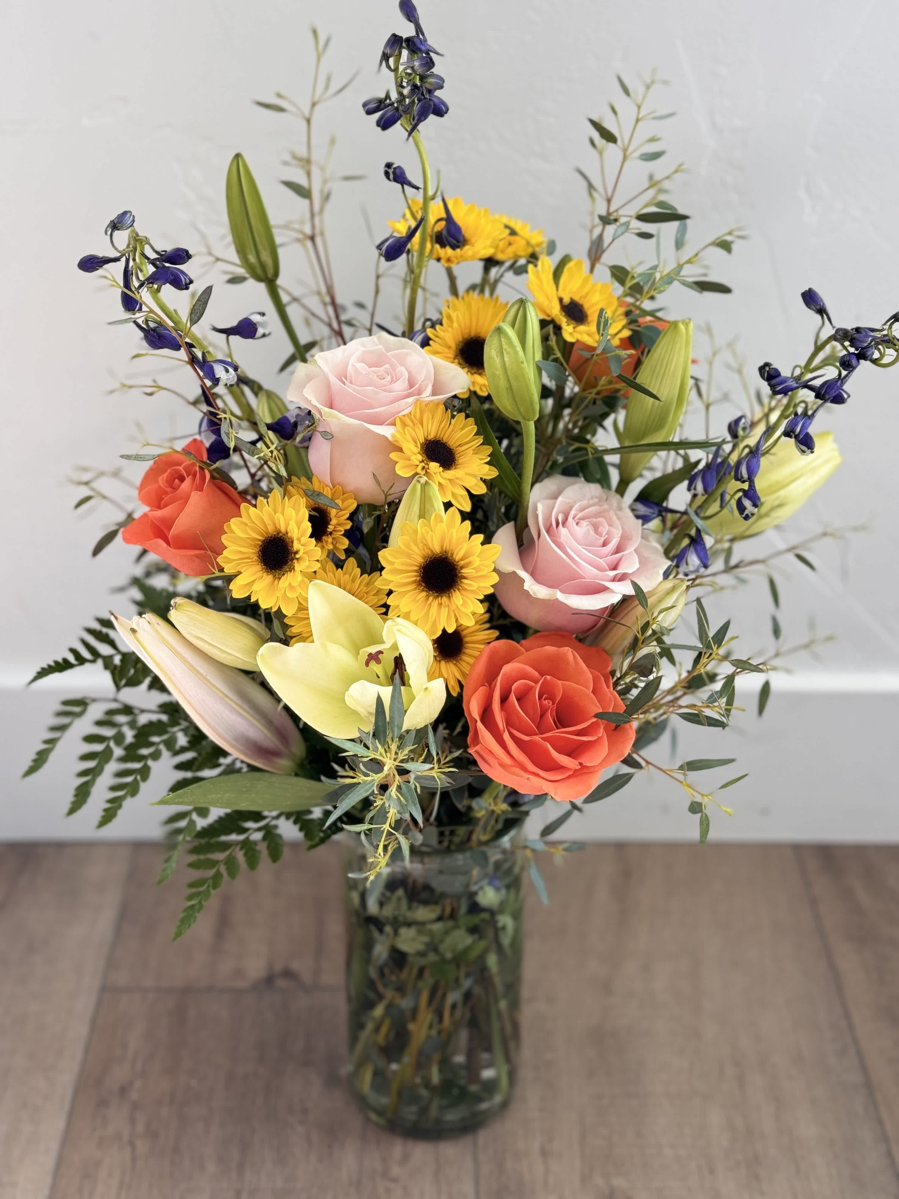 $55 Custom arrangement - Daises, roses, lilies, and more! This custom arrangement will include approximately 8-9 stems and fill in a vase!