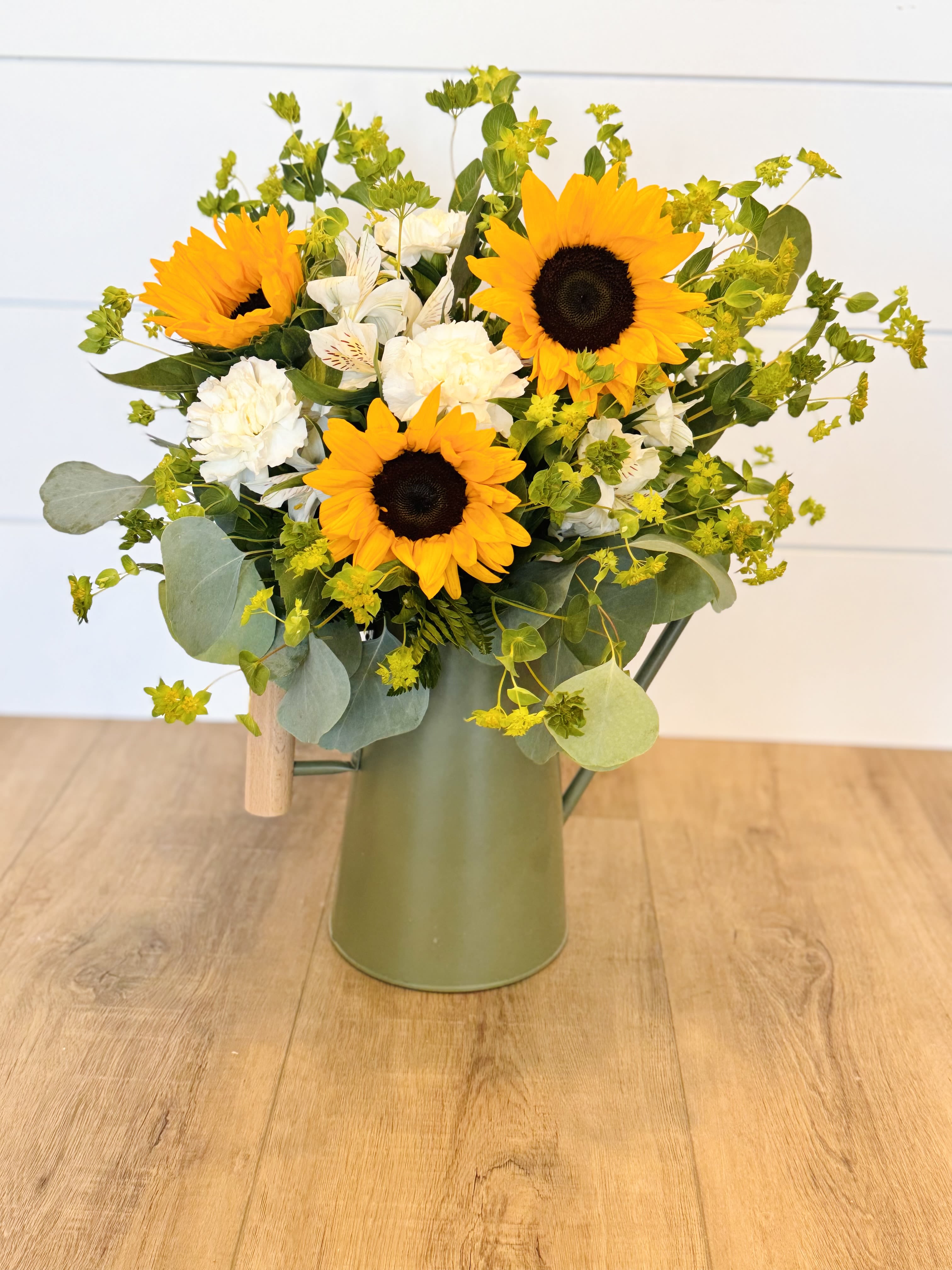 Sunflower Surprise - Sunflowers and fill in a beautiful green watering can.