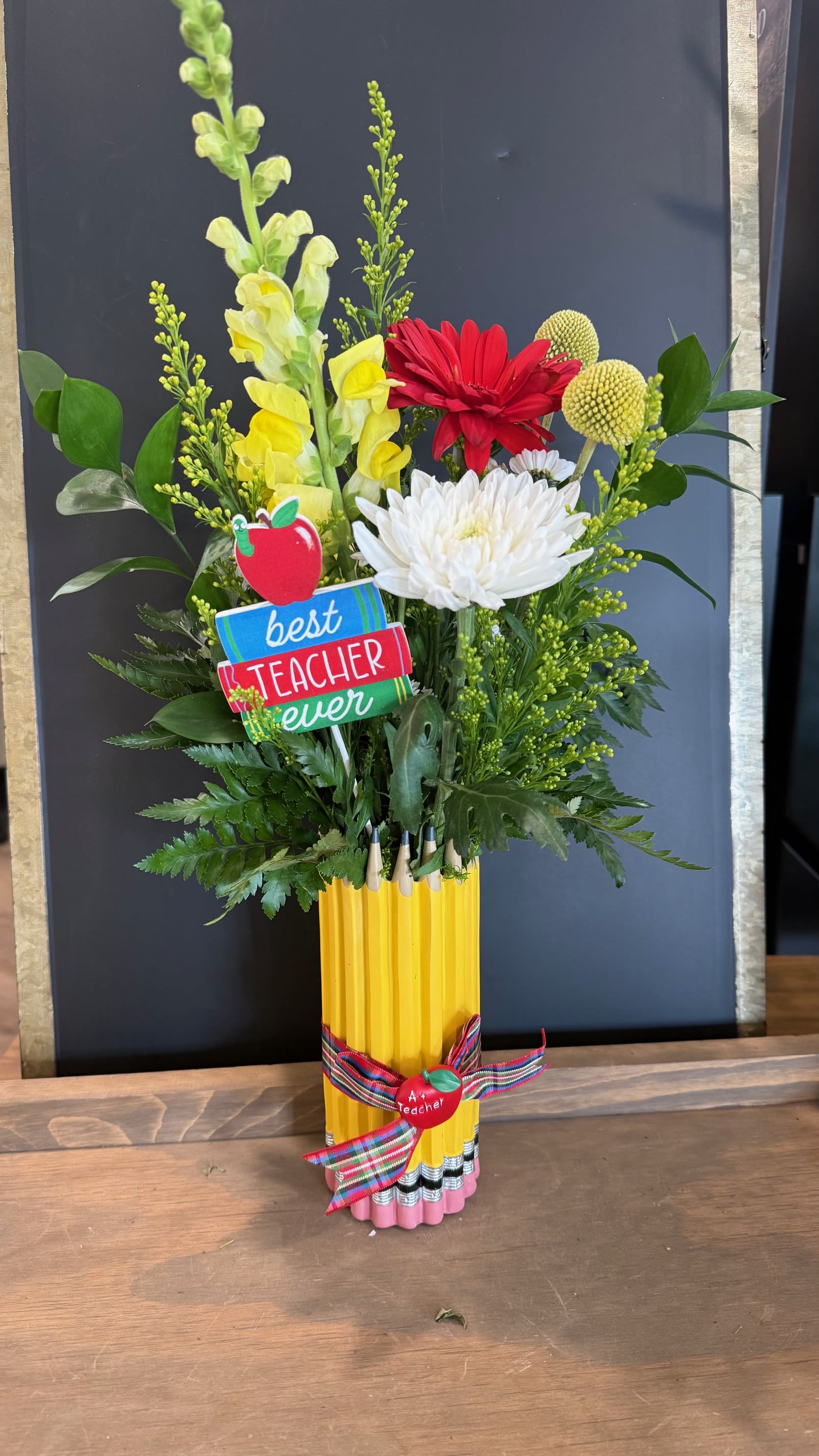 Pencils and Blooms - A pencil themed vase filled with bright and cheery blooms, accented with a book or apple themed pick- a perfect thank you for your favorite teacher!