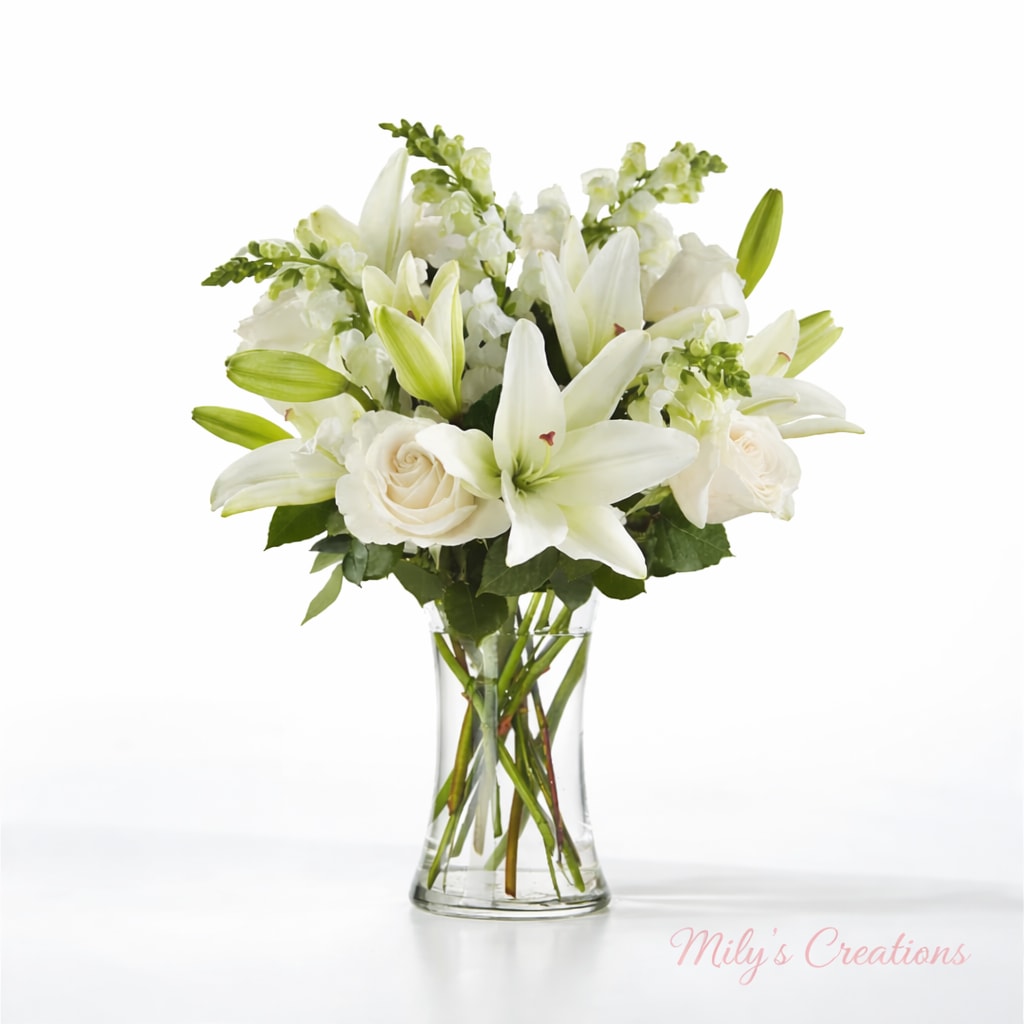Eternal Friendship Bouquet - “Pure Elegance” is a sophisticated bouquet that embodies grace and serenity. Featuring pristine white lilies, delicate white roses, and elegant white snapdragons, this arrangement exudes timeless beauty. Perfect for expressing sympathy, celebrating milestones, or creating a tranquil ambiance, its harmonious design speaks of purity and heartfelt sentiments.