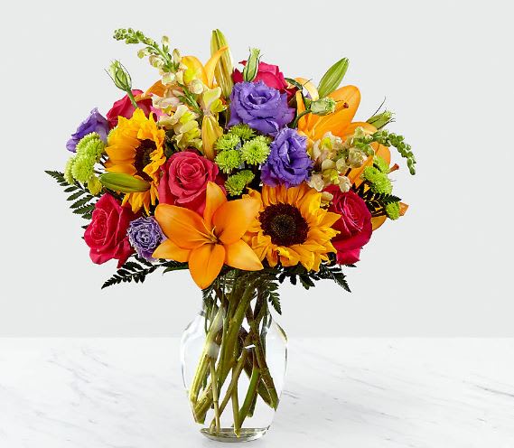 Colorful mixed bouquet in a clear glass vase