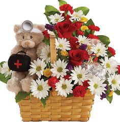Basket of red roses and white daisies with a teddy bear holding a black heart