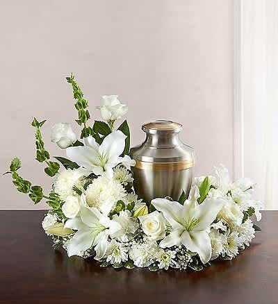  Honor a life  All White  Cremation Flowers  - .Consider honoring your loved one with extraordinary beauty. Honor a life  cremation arrangement  with roses, lilies, carnations and more. An urn or framed photograph can be placed in the open center, creating a comforting tribute for the cremation or memorial service. 