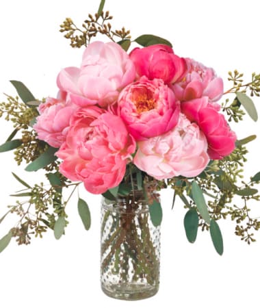 Pink peony bouquet in a clear glass vase