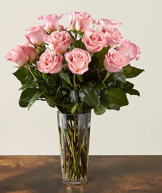Long Stem Pink Rose Bouquet - Enjoy the classic beauty of the rose with a playful twist in our Long Stem Pink Rose Bouquet. This arrangement features all pink roses that will look especially pretty in the hands of those you cherish most.