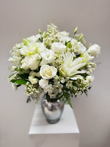 White floral bouquet in a silver vase