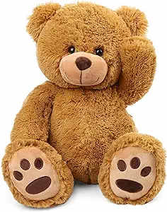 Brown teddy bear plush toy sitting with one paw raised