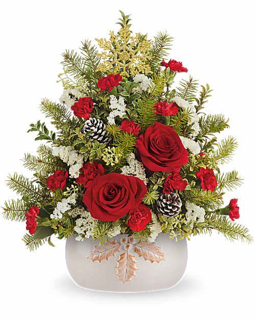 Teleflora's Winter Holly Tree Bouquet - Teleflora's Winter Holly Tree Bouquet is a fresh take on a Christmas classic! Red roses, spray roses, and miniature carnations are hand-arranged with winter greens, pinecones, and golden accents in Teleflora's Holly Season Bowl. A festive Christmas arrangement with tree-inspired style.