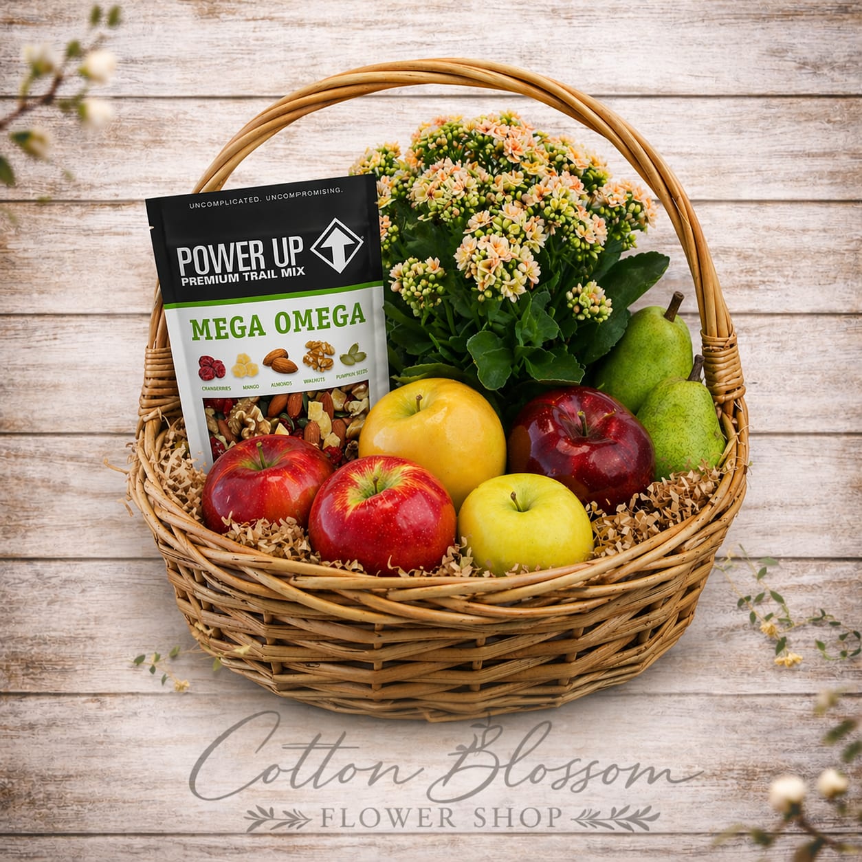 Happy &amp; Healthy Basket - Happy &amp; Healthy Basket    Send a thoughtful gift of freshness and goodness with our Happy &amp; Healthy Basket. This charming arrangement is filled with a delightful mix of crisp apples, juicy pears, and a selection of trail mix, mixed nuts, and peanuts — perfect for anyone who enjoys wholesome, feel-good treats.    A vibrant blooming plant adds a cheerful touch of color, making this gift as beautiful as it is delicious. Arranged in a classic wicker basket, it’s a wonderful choice for get well wishes, thank-you gifts, sympathy gestures, or simply encouraging someone on a healthy path.    Fresh, flavorful, and full of natural goodness, this basket is sure to brighten anyone’s day.    Please Note:  • Basket style may vary  • This item may require additional lead time and may not be available for same-day delivery    Hand-prepared with care by Cotton Blossom Flower Shop, proudly serving Maricopa, Casa Grande, and Stanfield, Arizona.