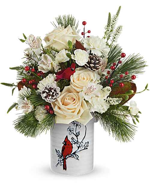 Teleflora's Merry Cardinal Bouquet - Teleflora's Merry Cardinal Bouquet brings a fresh, wintry palette to the season. Cream roses and white blooms are hand-arranged with evergreens and berries in Teleflora's Woodland Cardinal Crock, creating a Christmas arrangement with soft color and natural texture.
