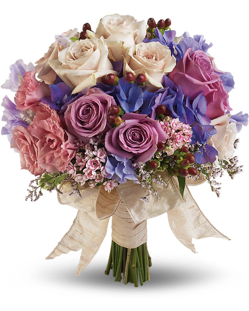 Bouquet of cream, pink, and purple roses with blue flowers and ribbon