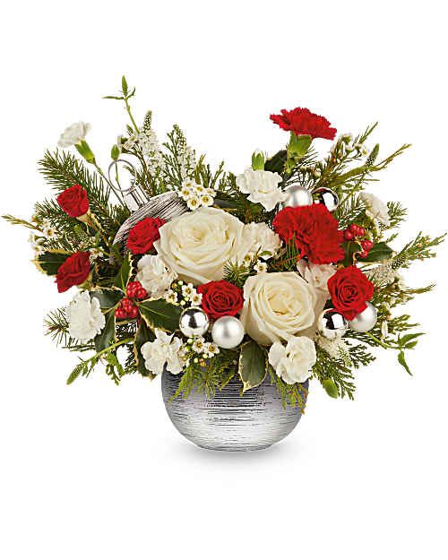 Teleflora's Silver Radiance Bouquet - Teleflora's Silver Radiance Bouquet blends classic Christmas color with a bright, modern finish. Red and white blooms are hand-arranged with winter greens and festive accents in Teleflora's Silver Sparkle Ornament, creating a balanced holiday arrangement with standout style.