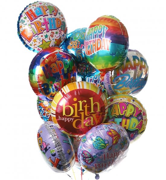 Cluster of colorful birthday balloons with printed messages