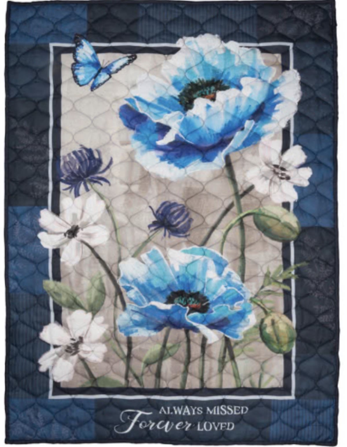 Always Missed Quilted Throw - Featuring a beautiful floral print in calming shades of blue, white, and soft neutrals, the Always Missed quilt is a thoughtful keepsake designed to bring comfort, warmth, and remembrance. The touching sentiment, “Always Missed, Forever Loved,” serves as a gentle reminder of cherished memories and lasting connections.  This cozy throw quilt makes a meaningful gift for family members, friends, neighbors, coworkers, or anyone who could use a little extra comfort and encouragement. The classic floral artwork and timeless color palette complement a variety of decorating styles, making it suitable for display on a sofa, recliner, bed, guest room, or favorite reading chair.  Each quilt is beautifully presented in a clear gift bag and finished with a coordinating decorative bow, creating an elegant presentation that is ready to give. Whether sent as a sympathy gift, memorial keepsake, remembrance gift, thinking-of-you gesture, encouragement gift, or simply as a way to let someone know they are loved, this quilt offers both beauty and practical comfort.  The Always Missed quilt is a thoughtful expression of love, support, and remembrance that can be treasured for years to come. Its comforting message, floral design, and everyday usefulness make it a meaningful keepsake for many occasions and recipients.