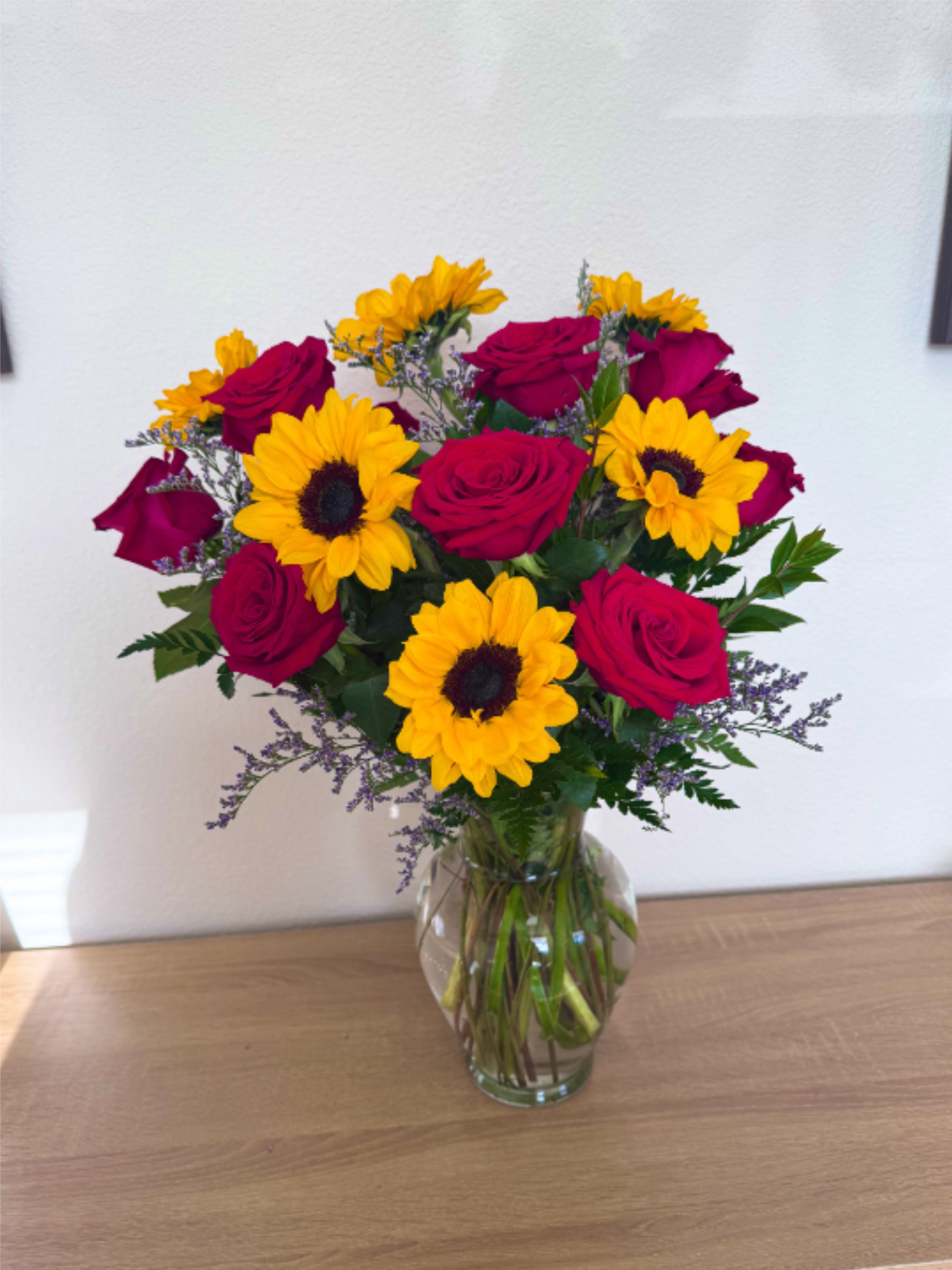 Sunshine Romance  - One dozen red rose and six sunflowers with. 