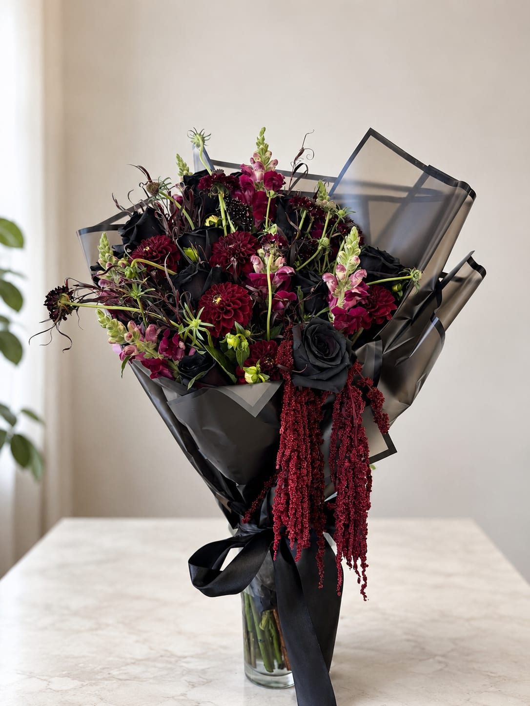 Gothic style bouquet - A dramatic and luxurious floral arrangement designed for lovers of dark elegance and bold style. This gothic-inspired bouquet features deep burgundy blooms, black roses, rich textures, and cascading accents wrapped in sleek black paper with satin ribbon details. Perfect for birthdays, artistic gifts, alternative weddings, romantic surprises, or anyone who loves moody and sophisticated flowers.  Handcrafted by Hollywood Blooms for a unique, modern floral experience with luxury flower delivery in Los Angeles. This statement bouquet combines dark romance with an elevated designer look, making it unforgettable from the very first glance.  Perfect for:  * Gothic aesthetic lovers * Luxury flower gifts * Alternative romantic bouquets * Birthday flower delivery * Dark floral arrangements * Editorial and fashion-inspired flowers  Available for flower delivery in Hollywood, West Hollywood, Beverly Hills, and surrounding Los Angeles areas.