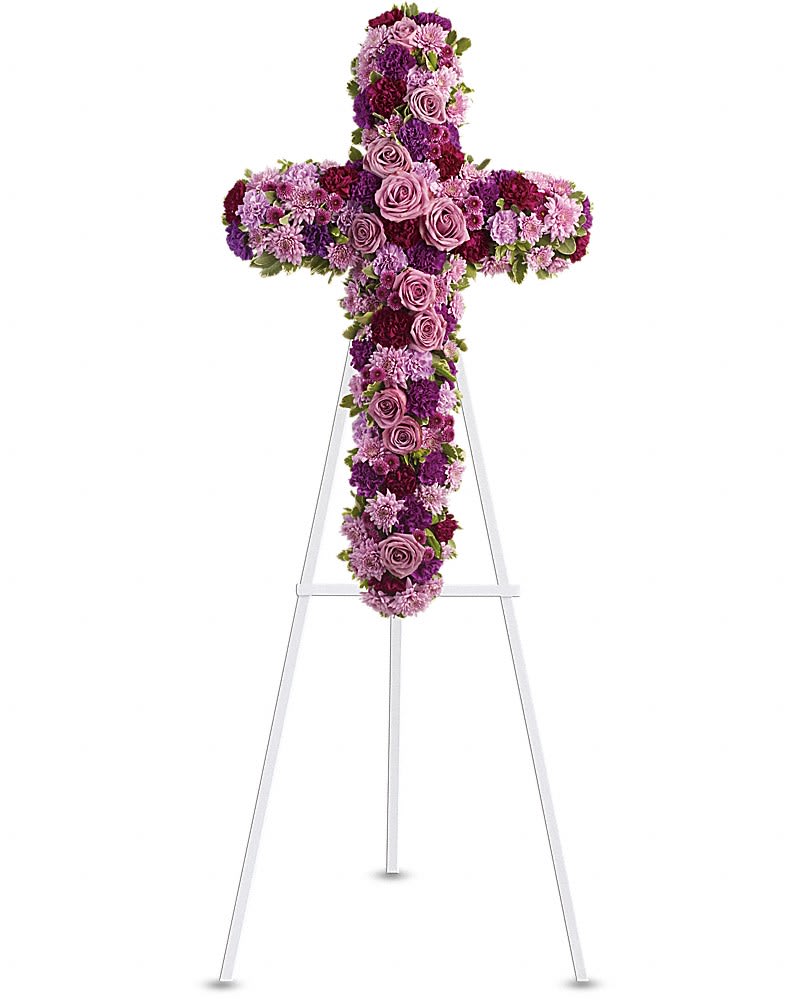 Purple floral cross on a white stand