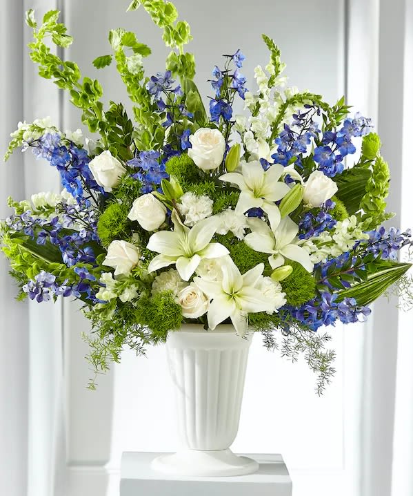 Heartfelt Hope Tribute  - Stately and memorable arrangement of delphiniums, snapdragons, trick dianthus, roses, carnations, lilies, aspidistra, Bells of Ireland and springerii. Vases may vary. (Note: Arrangement will be filled with the highest quality, freshest flowers available to the value of the order and therefore flower substitutions may be necessary.)
