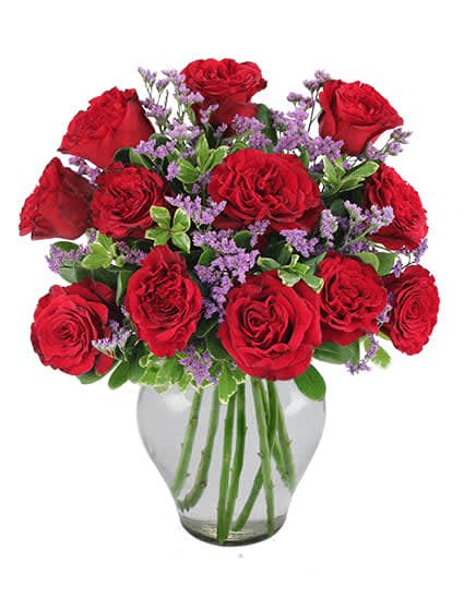 Garden Roses Bouquet - Take the traditional bouquet of roses to the next level with this arrangement! Succulent red roses are highlighted with delicate purple caspia for a new twist on an old favorite. Show her you mean forever with these flowers. Order online or call us today!!Standard: 12 Roses. Deluxe:18 Roses. Premium: 24 Roses.