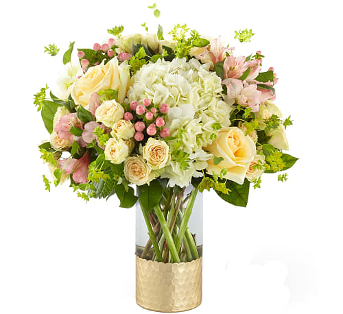 Simply Gorgeous Bouquet - Whether it’s to say “you’re so special" or “thank you so much", this bouquet helps you deliver every message of sweet, Spring sentiment. A gorgeous collection of white hydrangea, pale yellow roses, pale peach spray roses, and pale pink alstroemeria come together to make up our Simply Gorgeous Bouquet.