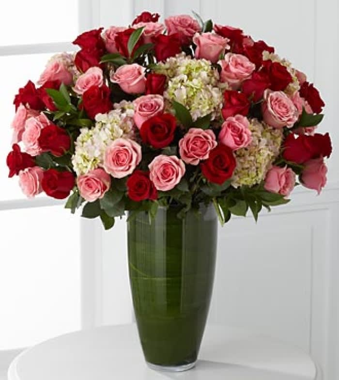 Indulgent Luxury Rose Bouquet  - Let your heart speak through a dazzling display of blooming beauty. 48 Stems of our finest 24-inch premium long-stem roses in blushing shades of pink and red are offset by clouds of soft pink hydrangea,