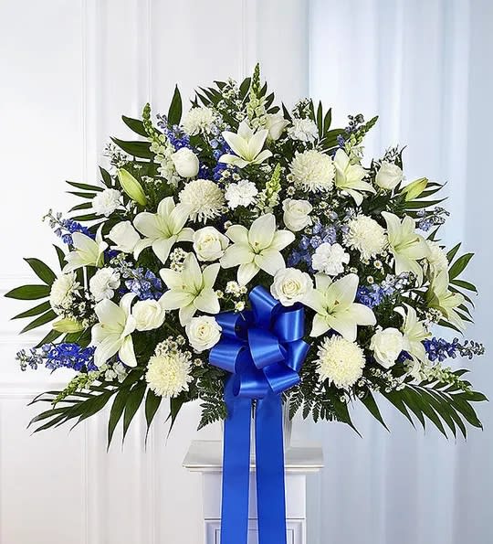 Blue &amp; White Floor Basket Arrangement - Offer the peace and tranquility that comes from classic blue and white flowers. Our elegant floor basket arrangement, handcrafted by our caring florists with pristine white and blue blooms, is a tasteful gesture perfectly suited for the funeral home or memorial services.