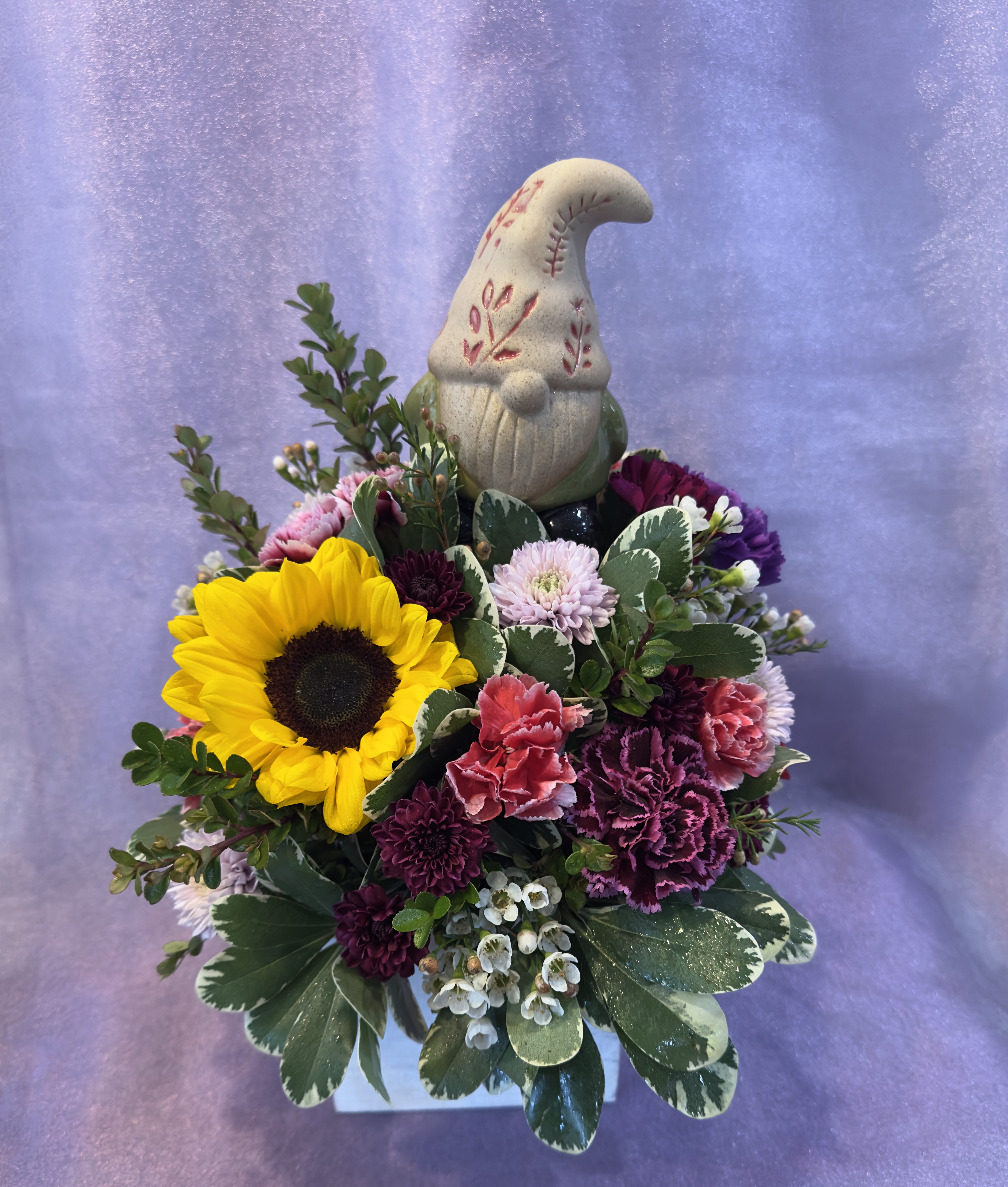 Love of Gnomes - Get this arrangement for a gnome lover! Comes with a decorative bobblehead Gnome and beautiful flowers.  The flowers will vary based on current supply of flowers.