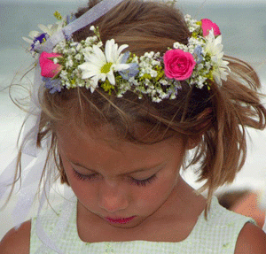 Girl wearing a floral crown with pink and white flowers