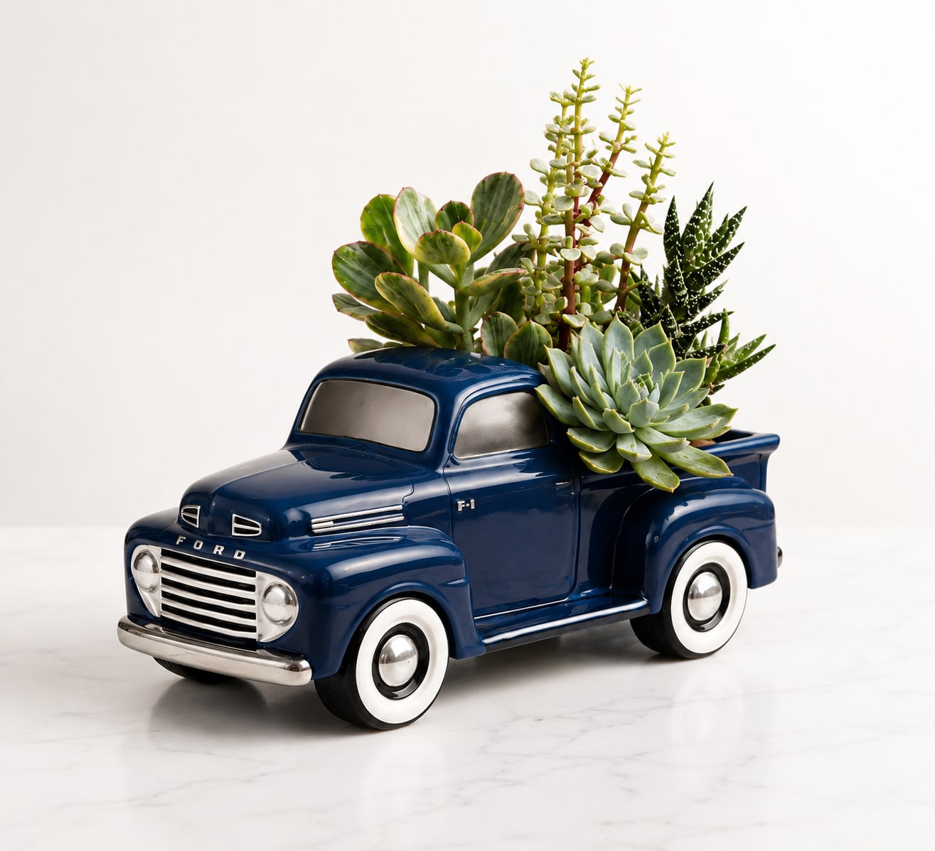 Classic Ford Succulent Truck - Celebrate timeless style with this collectible blue vintage truck filled with an assortment of healthy succulents. A unique keepsake that combines rustic charm with easy-care greenery, perfect for any occasion.