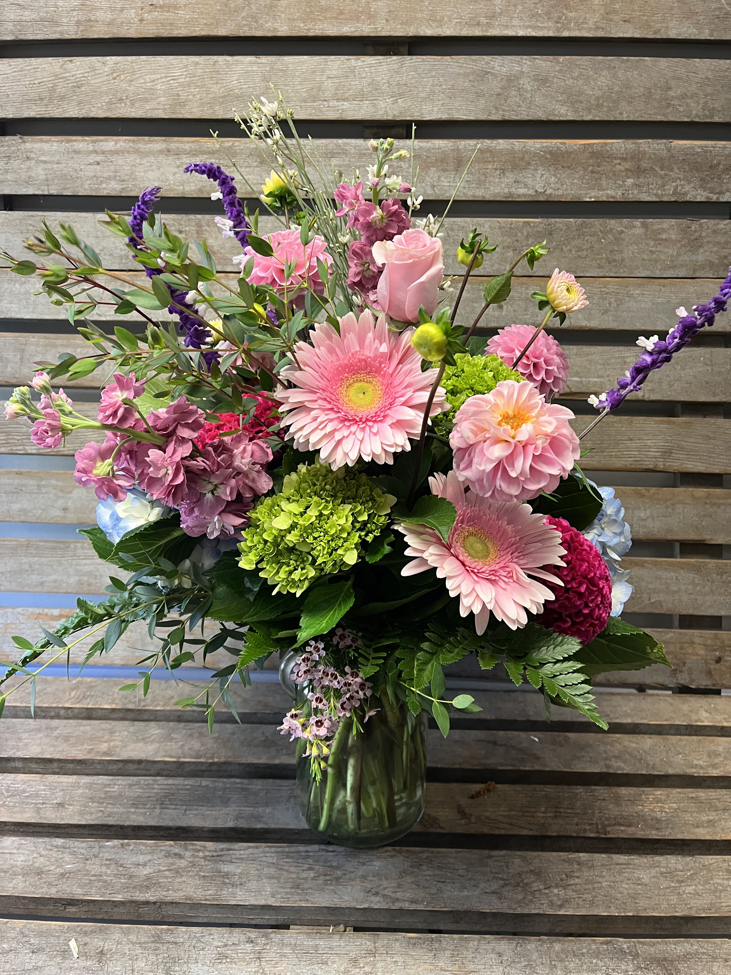 Pink and purple mixed bouquet in a glass vase