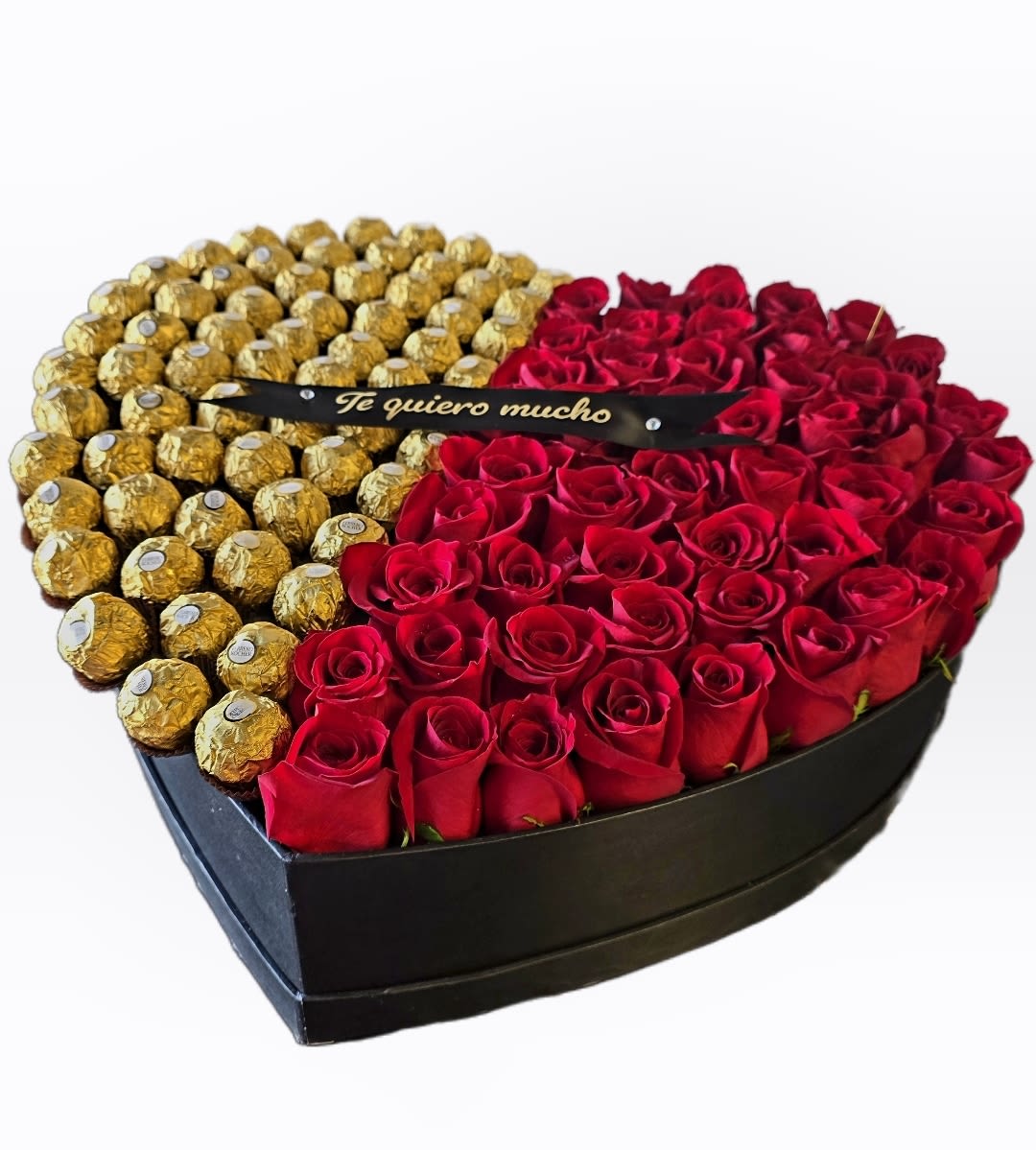 Heart-shaped box with red roses and gold-wrapped chocolates