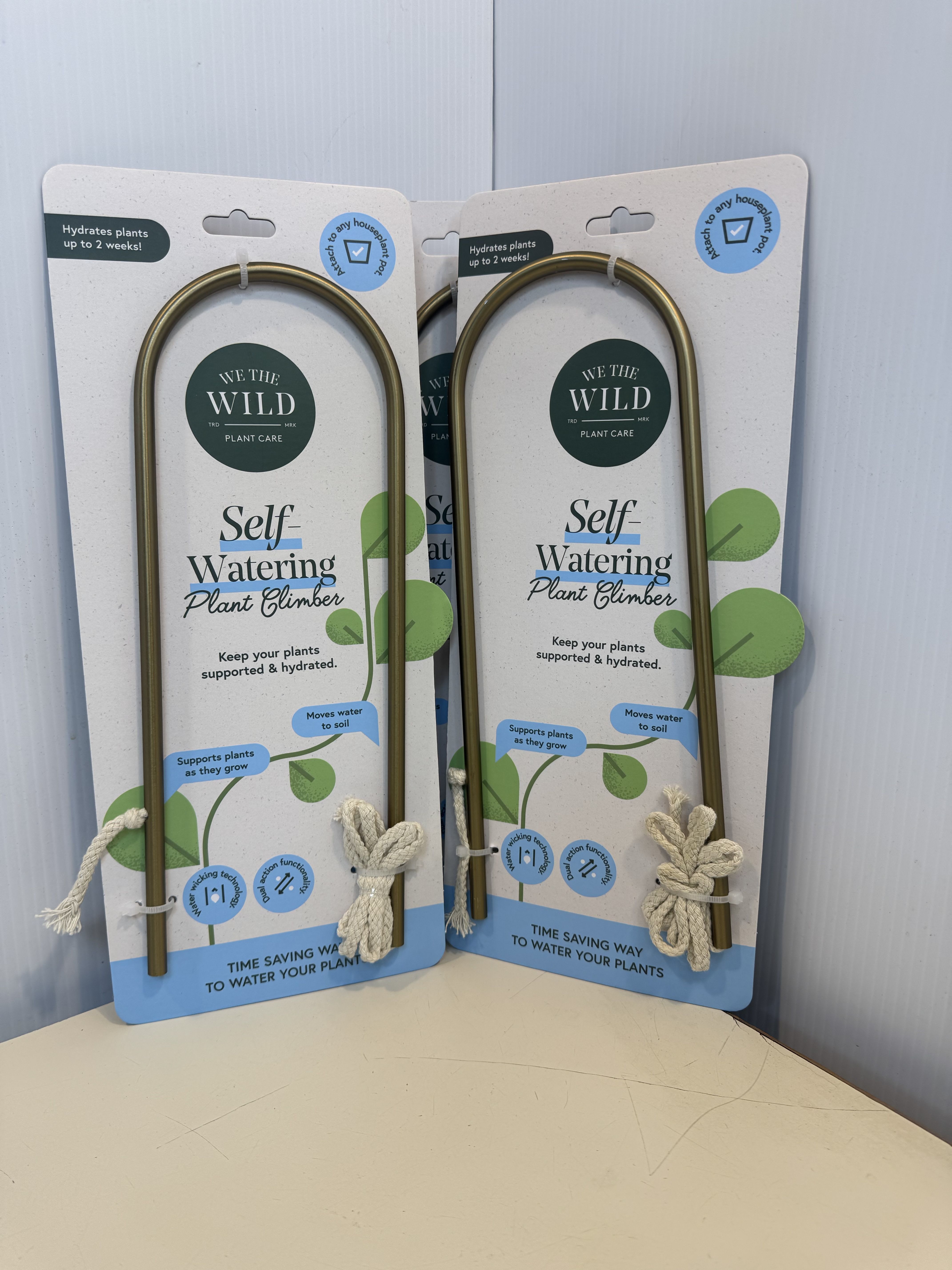 Packaged self-watering plant climbers with rope ties
