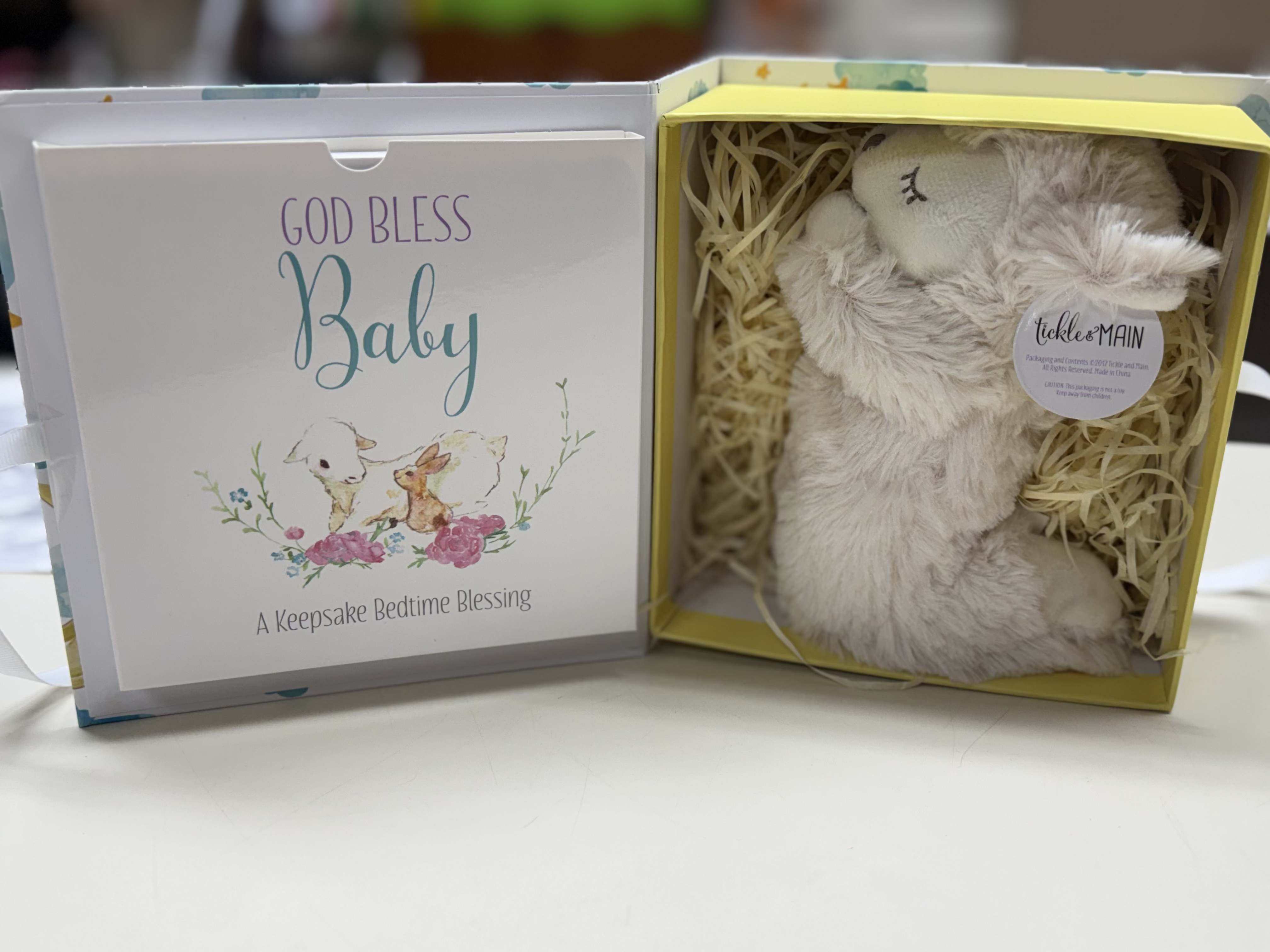 Gift box with a plush bunny and a baby blessing card