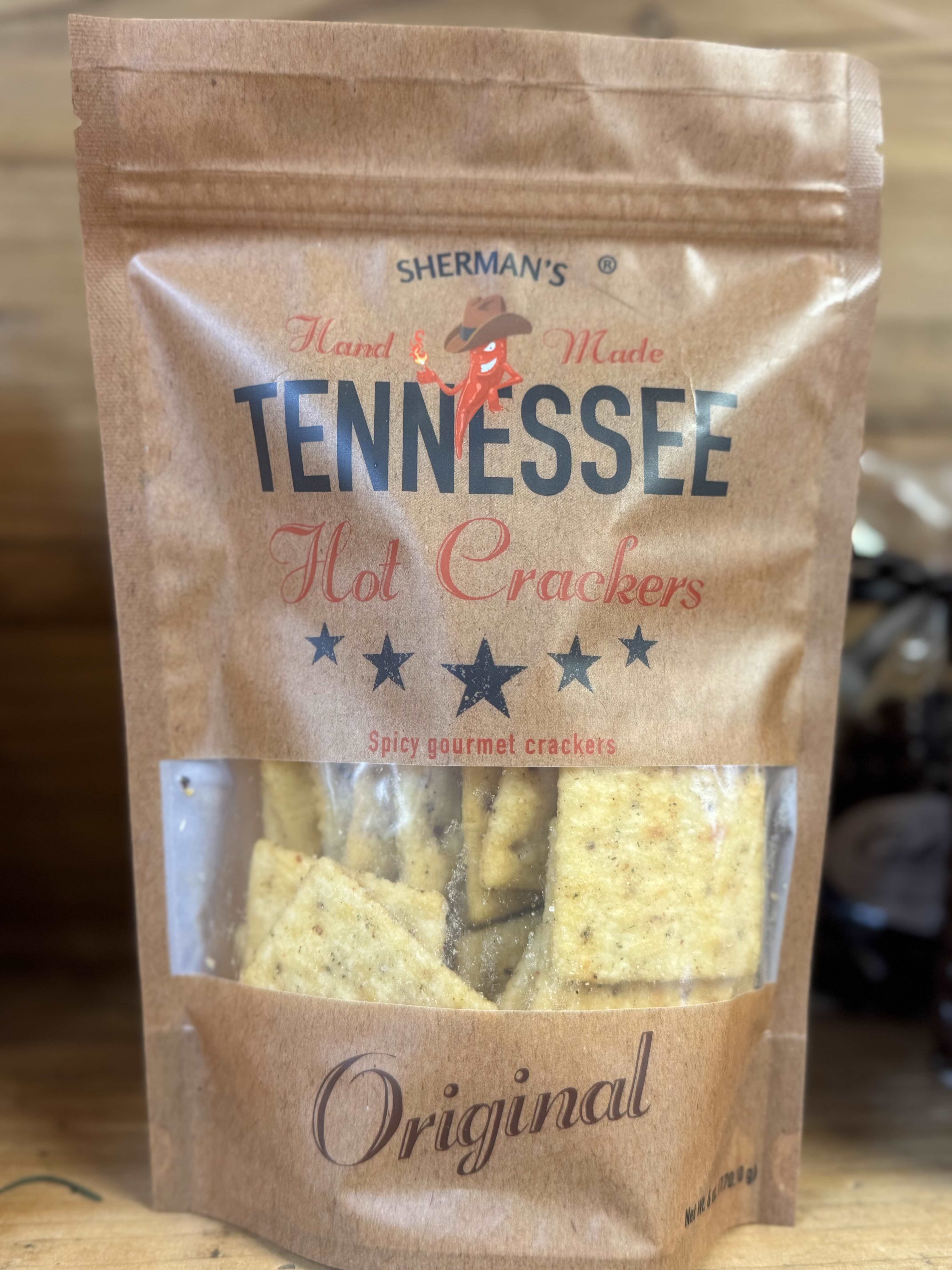 A bag of Sherman’s Tennessee hot crackers on a wooden surface.