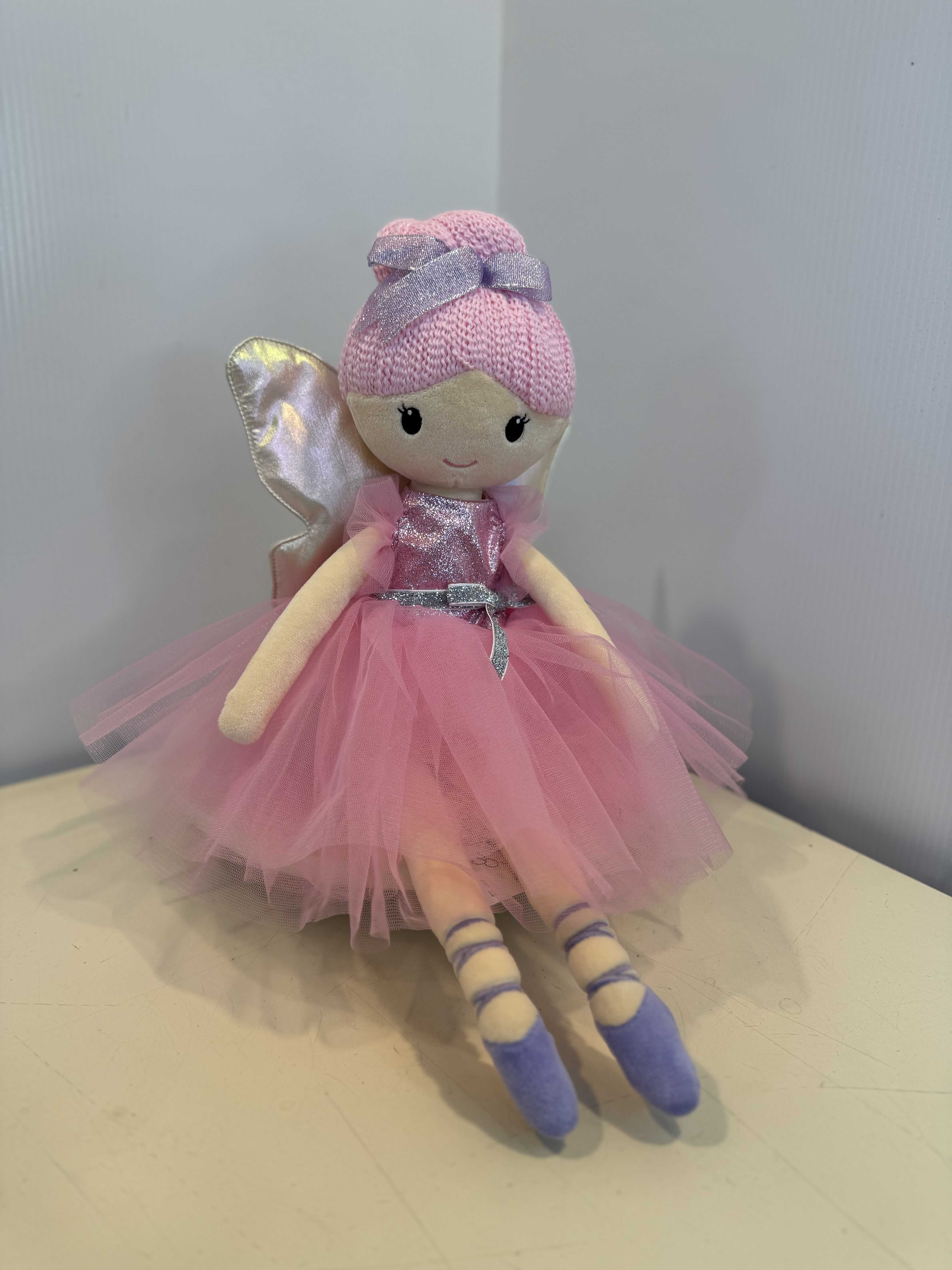 Fairy Ballerina Doll - Sweet fairy ballerina doll featuring shimmering wings, a glittery pink dress, and soft ballet slippers. A magical keepsake for special occasions. 