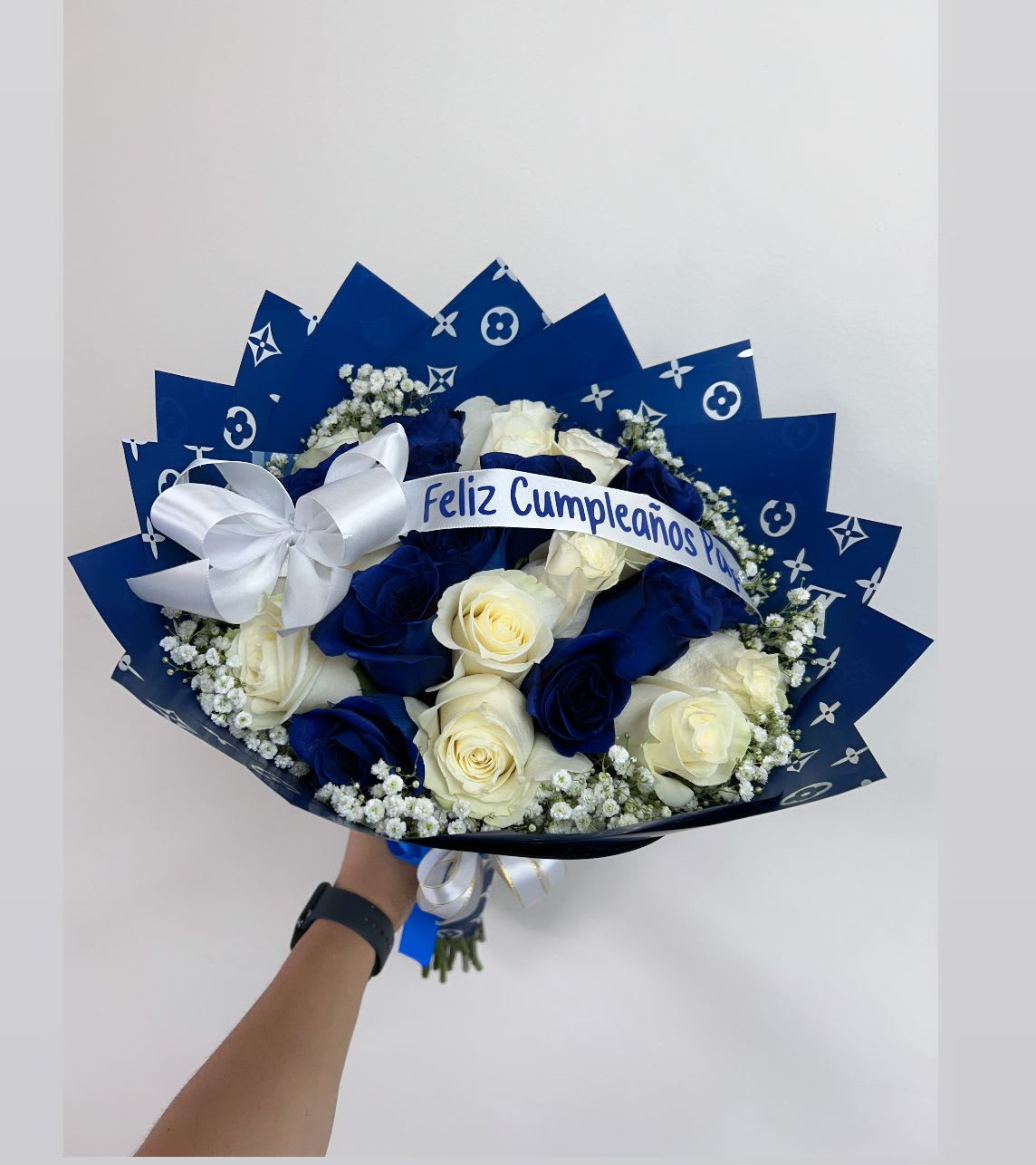 Blue and white rose bouquet with a birthday ribbon and bow